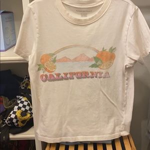 White “California” American Eagle tee.